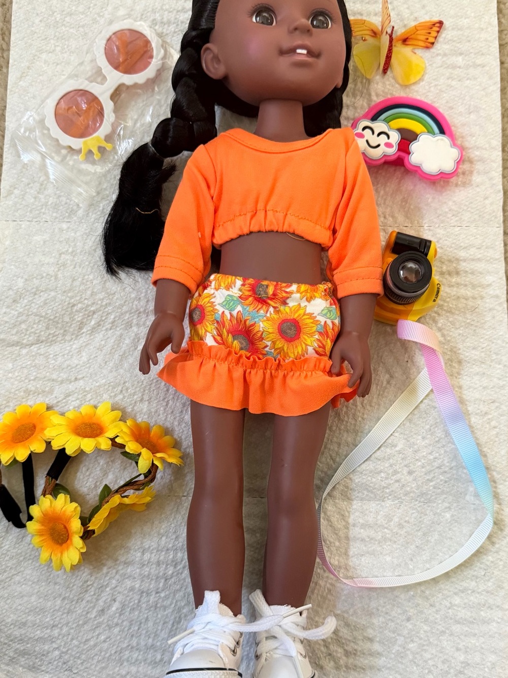 Doll included with Orange Sunflower Outfit with accessories.